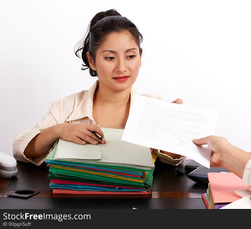 A businesswoman handing a document on a white background