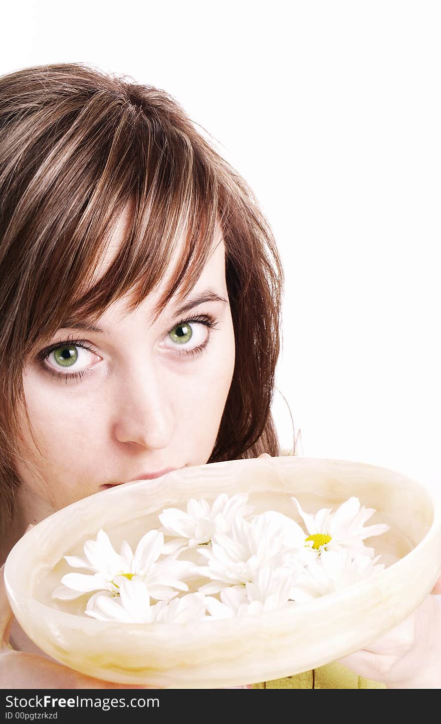 Close up of beautiful face and bowl full of flower. Close up of beautiful face and bowl full of flower