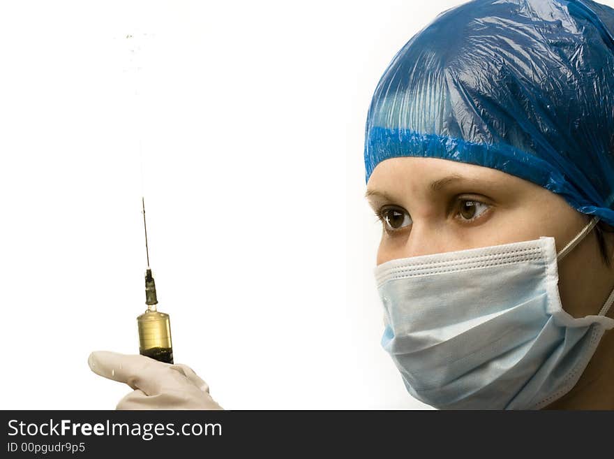 Woman doctors face with splashing syringe. Woman doctors face with splashing syringe