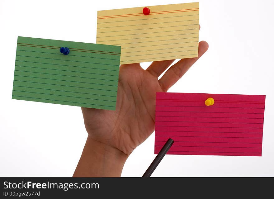 Three blank cards pinned on a hand