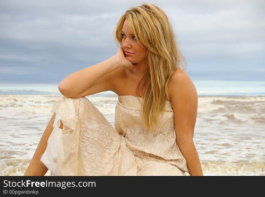 Beautiful girl on the beach during a storm. Beautiful girl on the beach during a storm