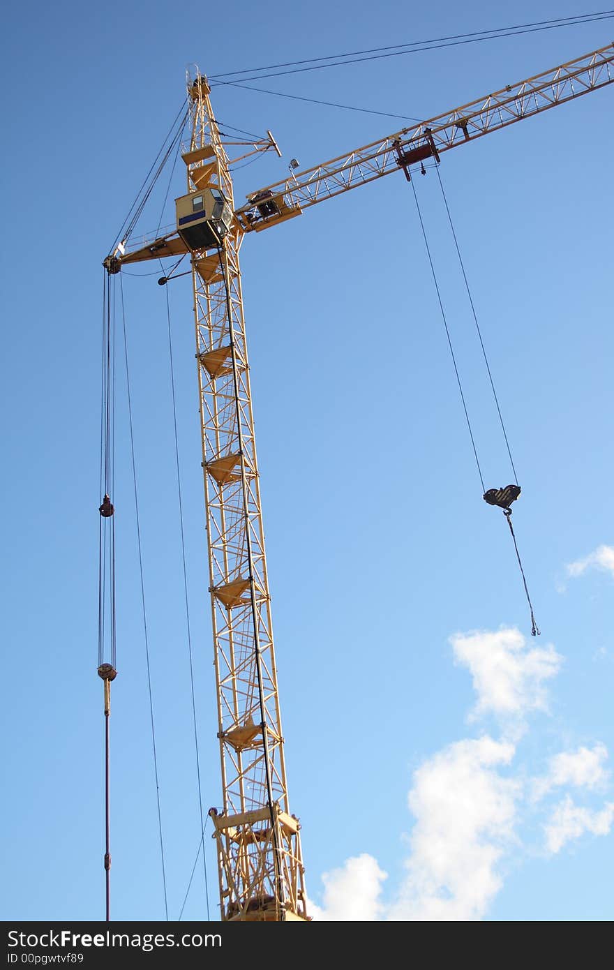 Building tower crane on blue sky