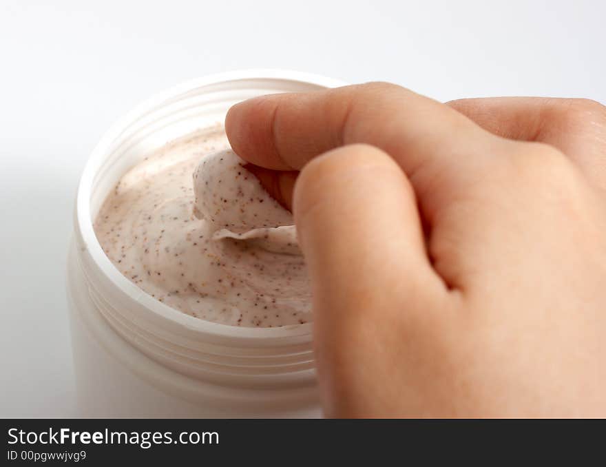 Photo of hands putting lotion over a white background