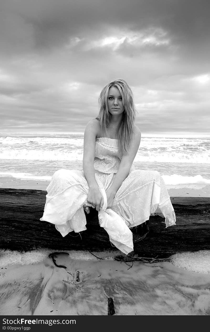 Beautiful girl on the beach during a storm. Beautiful girl on the beach during a storm