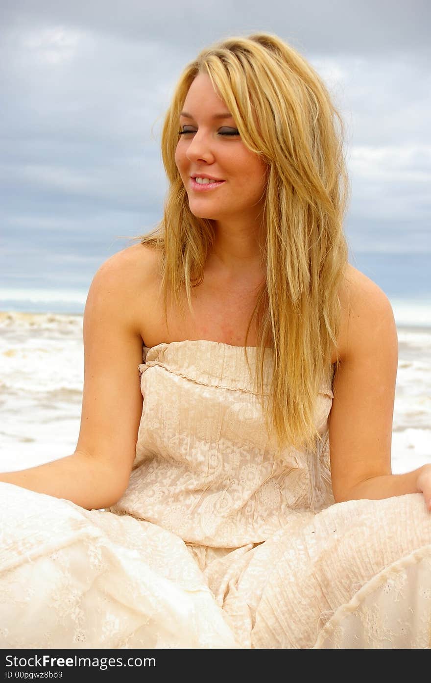 Beautiful girl on the beach during a storm. Beautiful girl on the beach during a storm