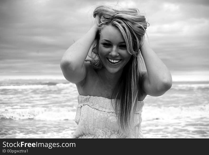 Beautiful girl on the beach during a storm. Beautiful girl on the beach during a storm