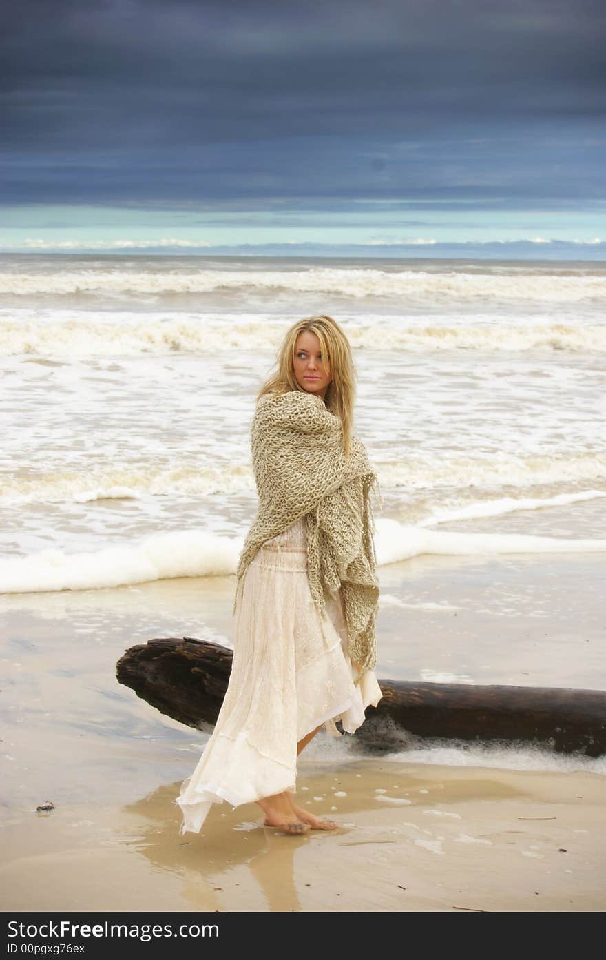 Beautiful girl on the beach during a storm. Beautiful girl on the beach during a storm