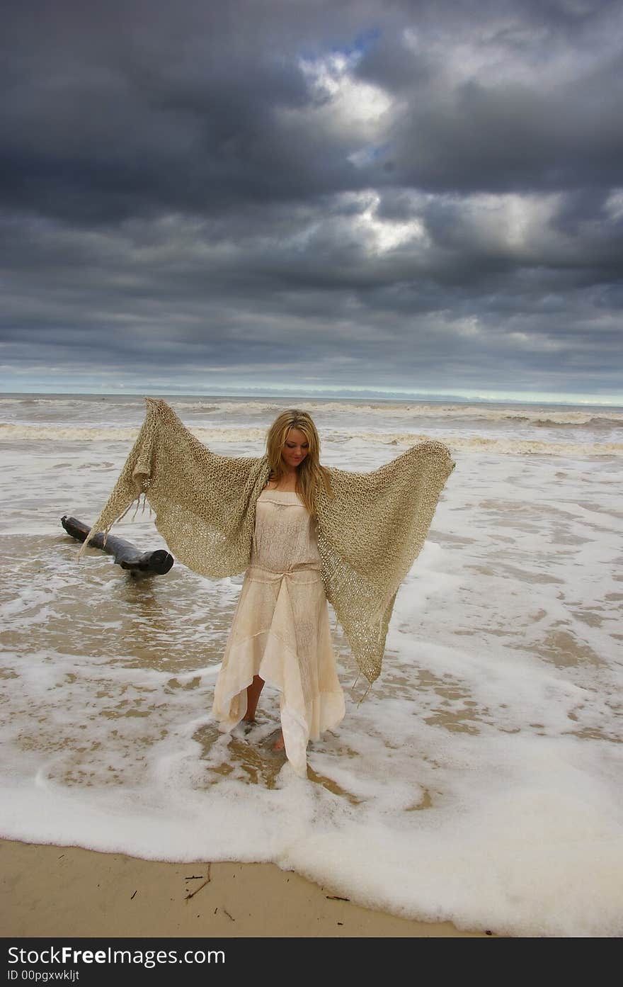 Beautiful girl on the beach during a storm. Beautiful girl on the beach during a storm