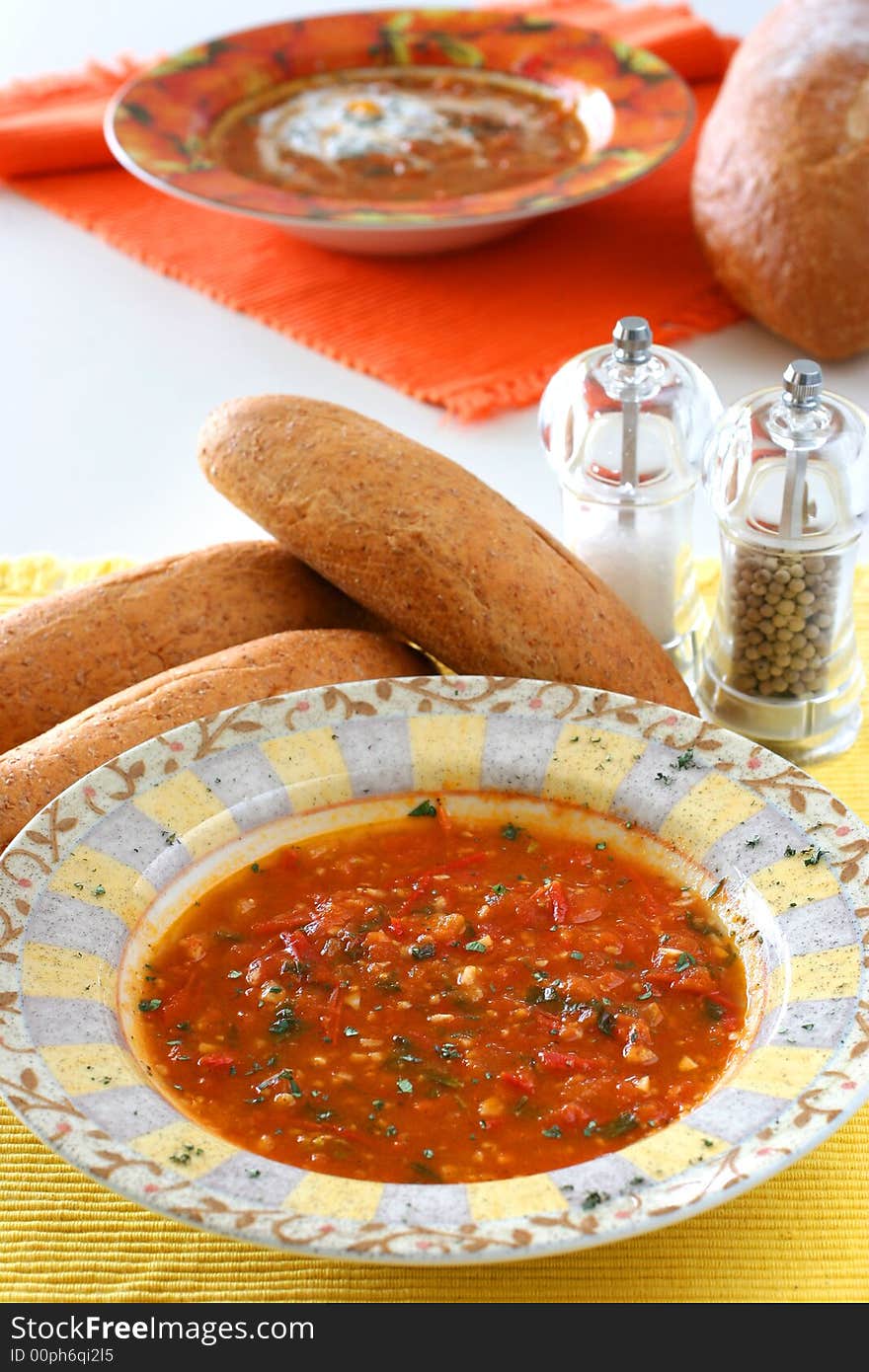 Chunky homemade tomato soup with chopped basil and garlic and a dash of olive oil