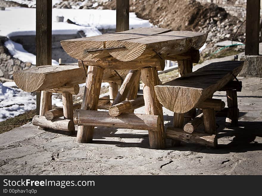 Wooden table with two benches