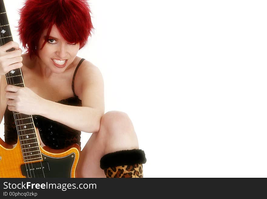 Beautiful redhead with guitar over white. Beautiful redhead with guitar over white.