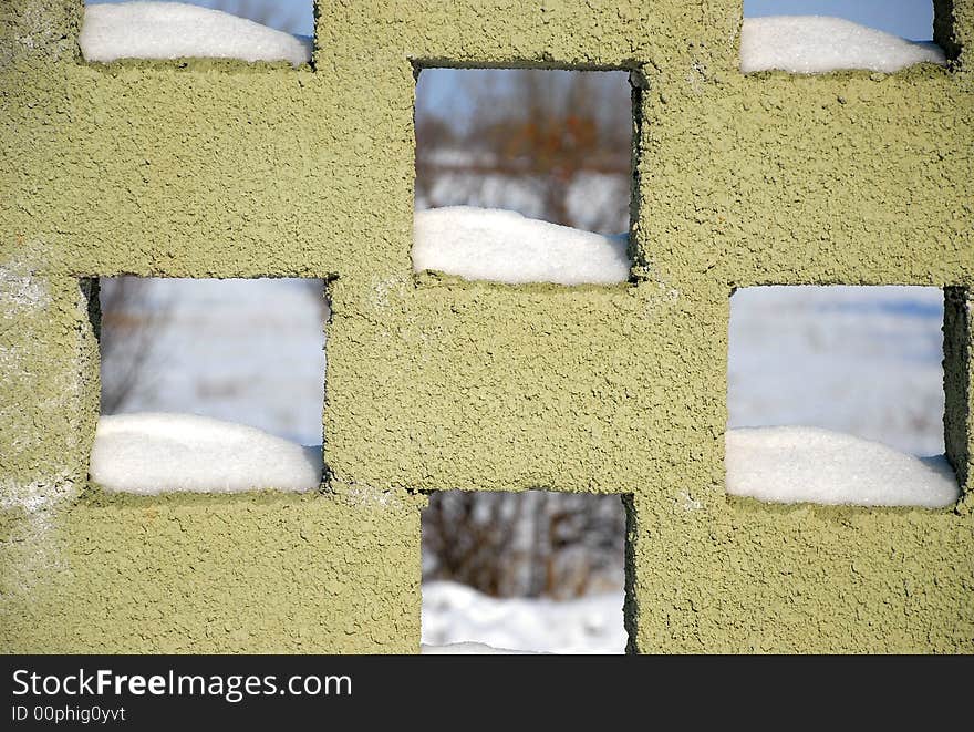 Decorational brick wall with snow hills. Decorational brick wall with snow hills