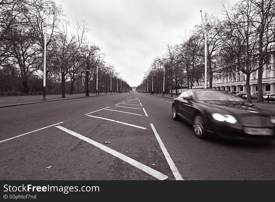 The Mall in London, with a car speeding by. The Mall in London, with a car speeding by