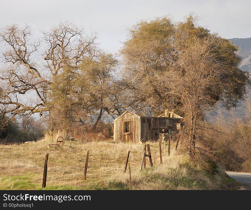 An old abandoned shack in the mountains during winter. An old abandoned shack in the mountains during winter.