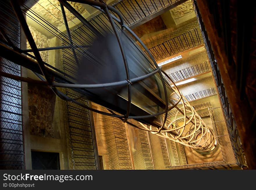 Elevator in a tower surrounded by stairs. Elevator in a tower surrounded by stairs