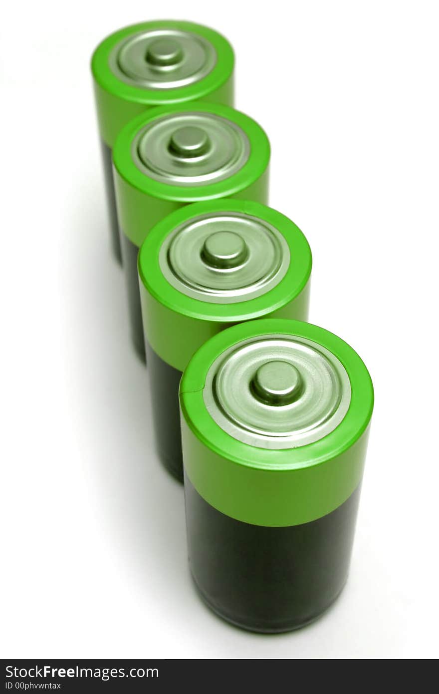 Four green batteries on white background.