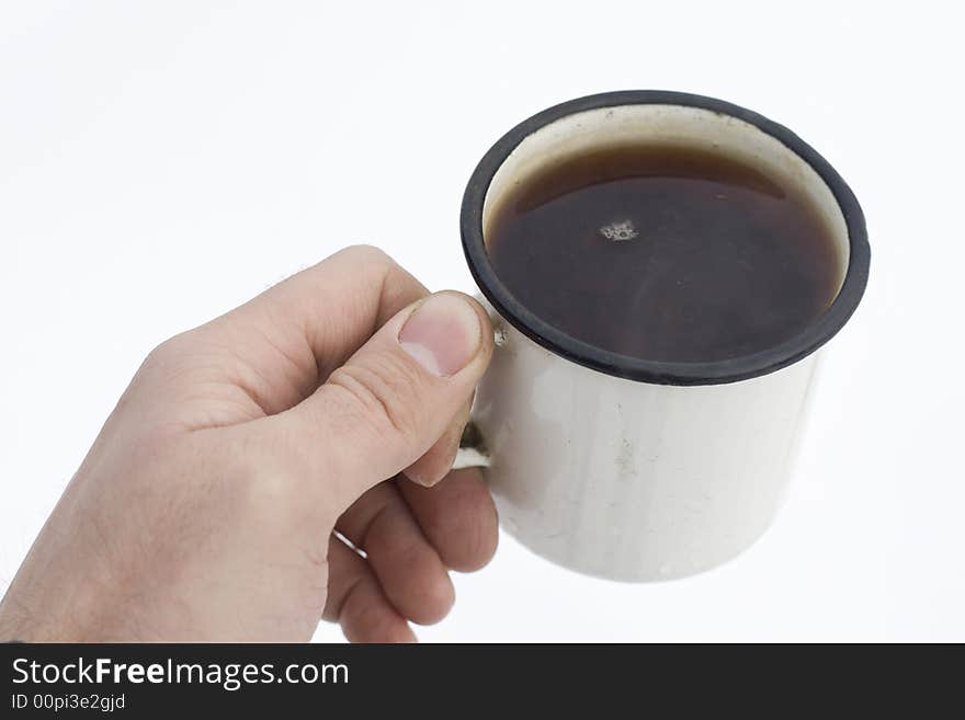 Cup of tea in human hand