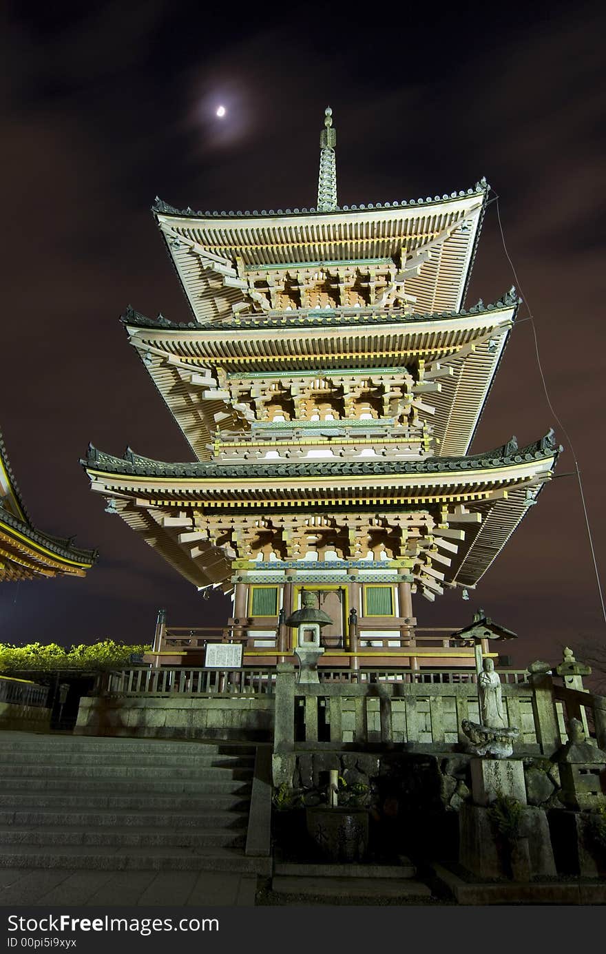 Kiyomizudera pagoda in Kyoto, Japan at moonlight and surrounding illumination