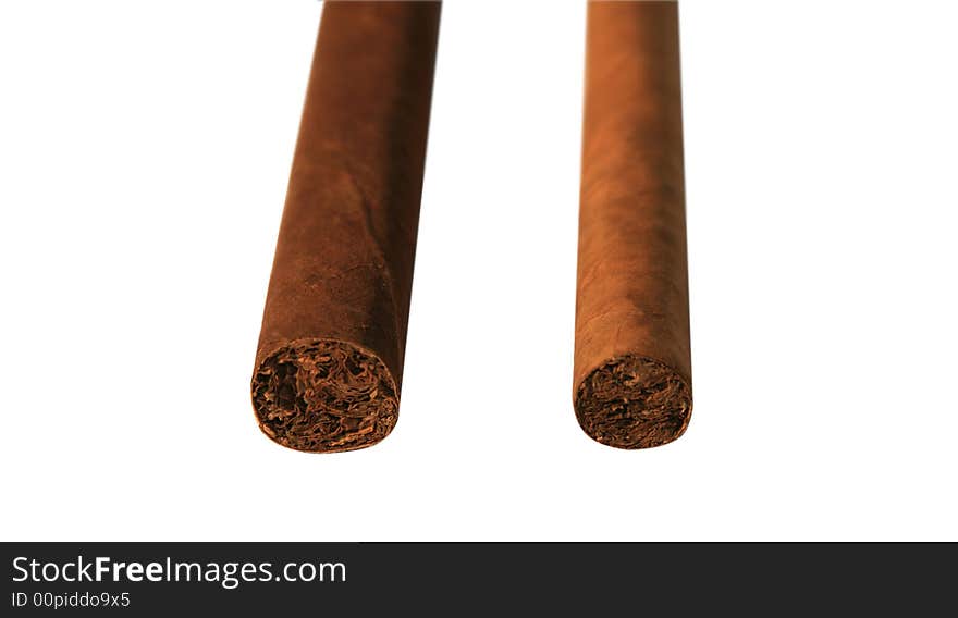 The Cuban cigar it is isolated on a white background. The Cuban cigar it is isolated on a white background