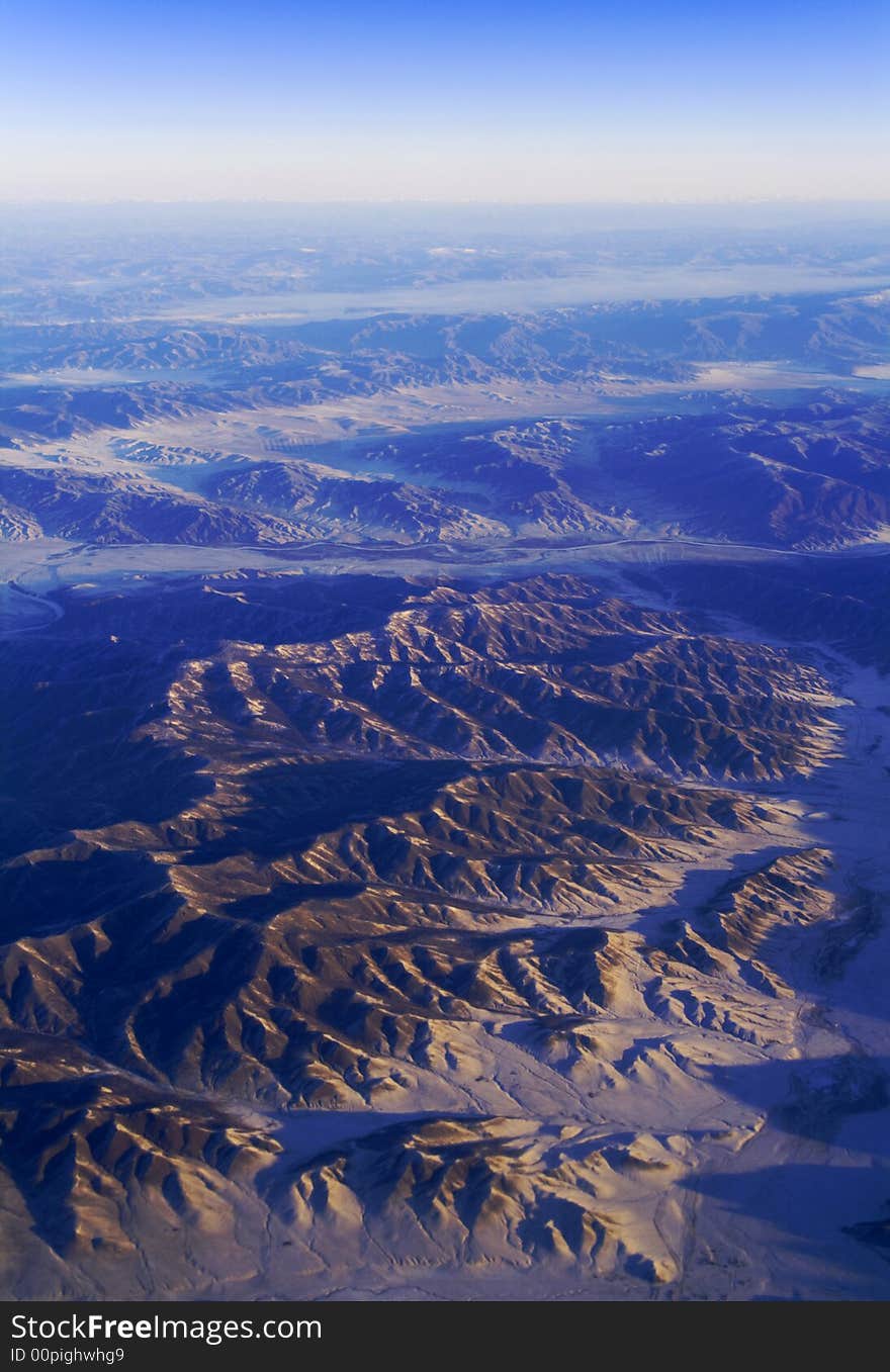 Sunrise in mountains from stratosphere