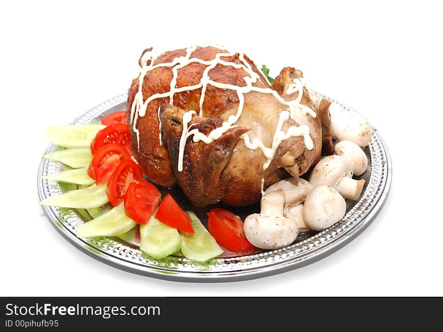 Grill chicken with vegetables on silver plate