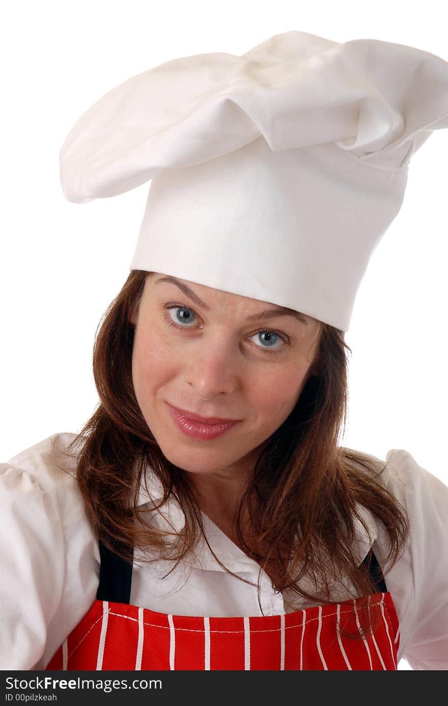 Portrait of pretty female chef in red apron smiling, isolated on white. Portrait of pretty female chef in red apron smiling, isolated on white