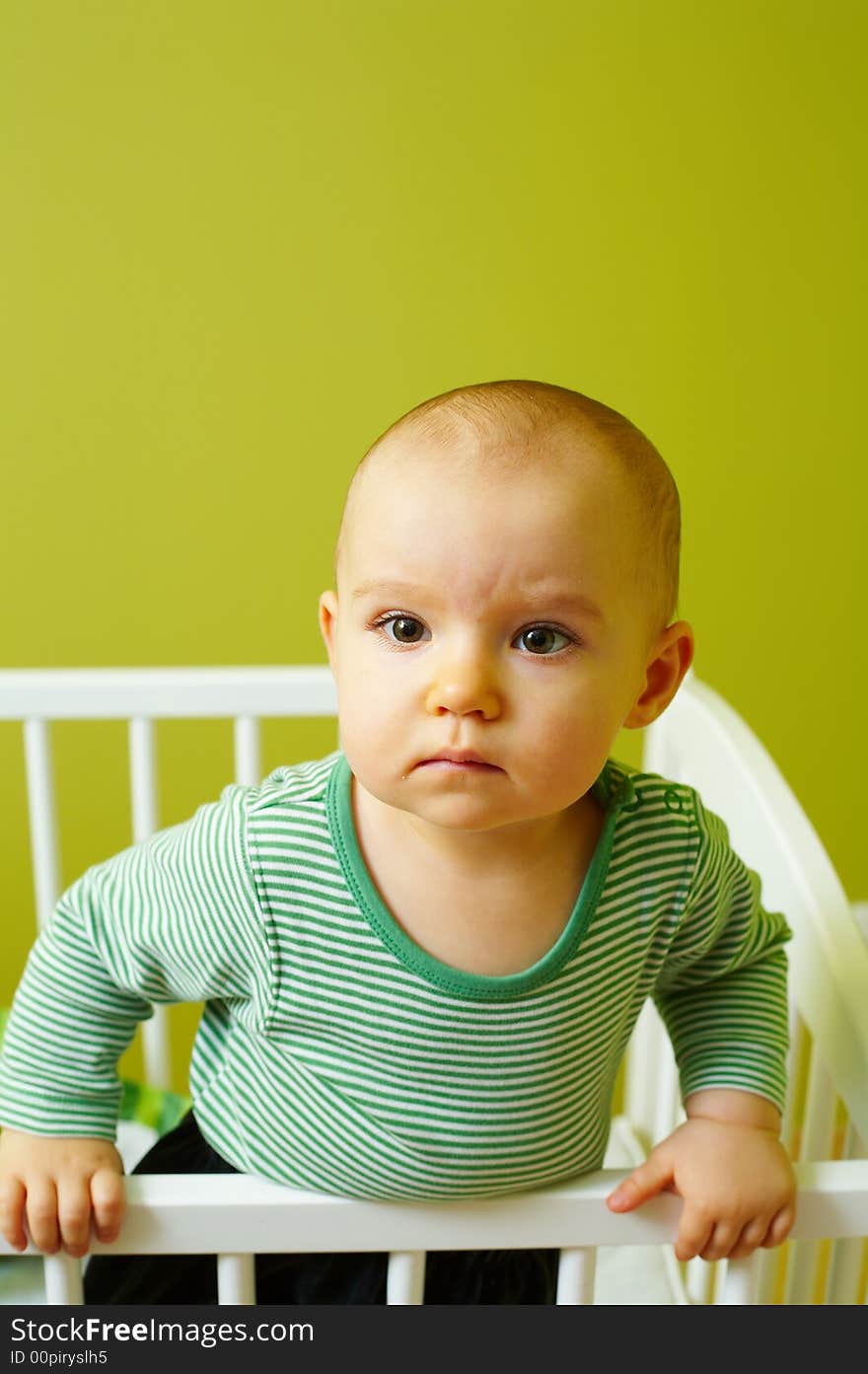 Portrait of little baby in crib