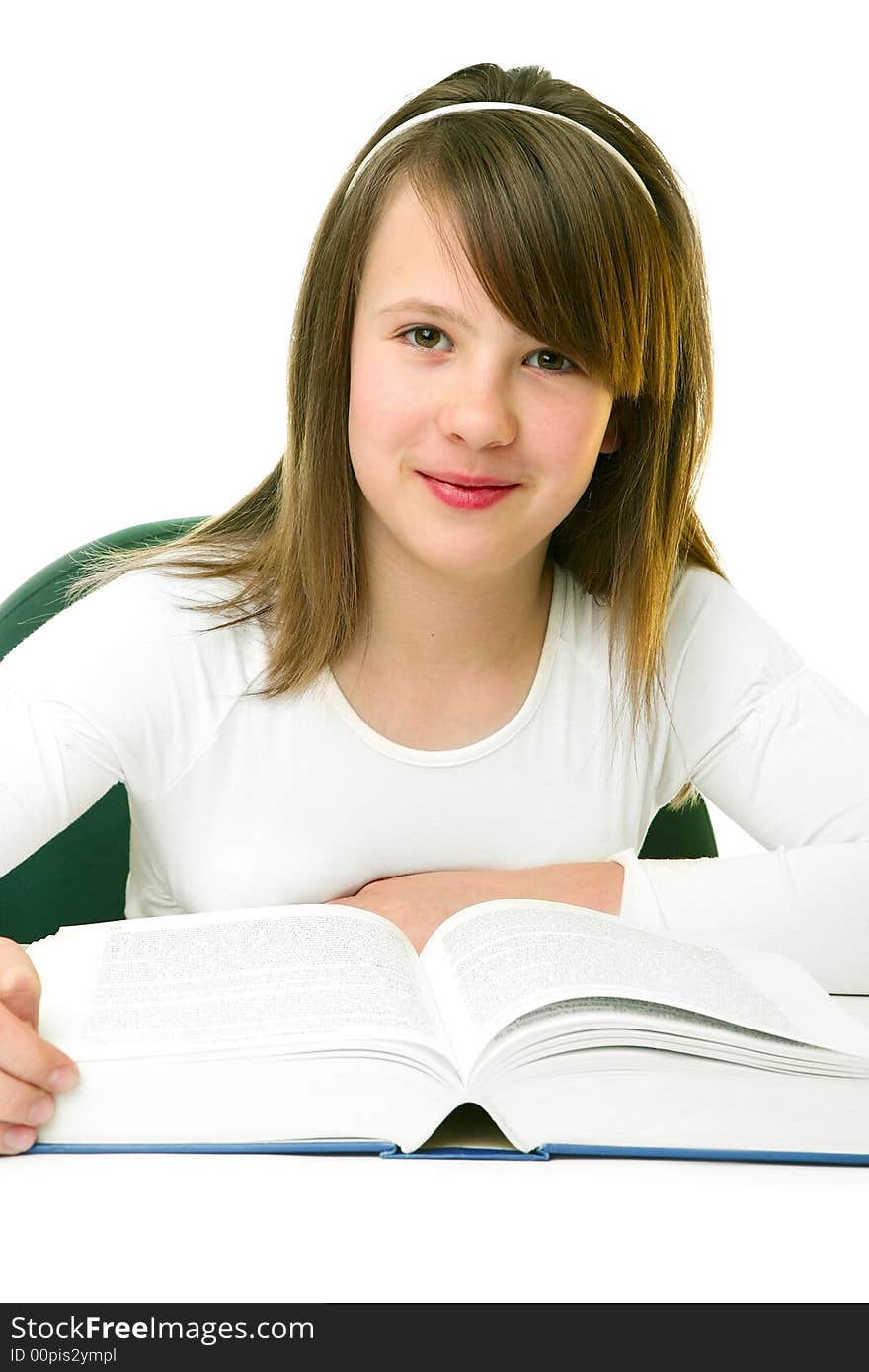 Portrait of Happy young schoolgirl reading book