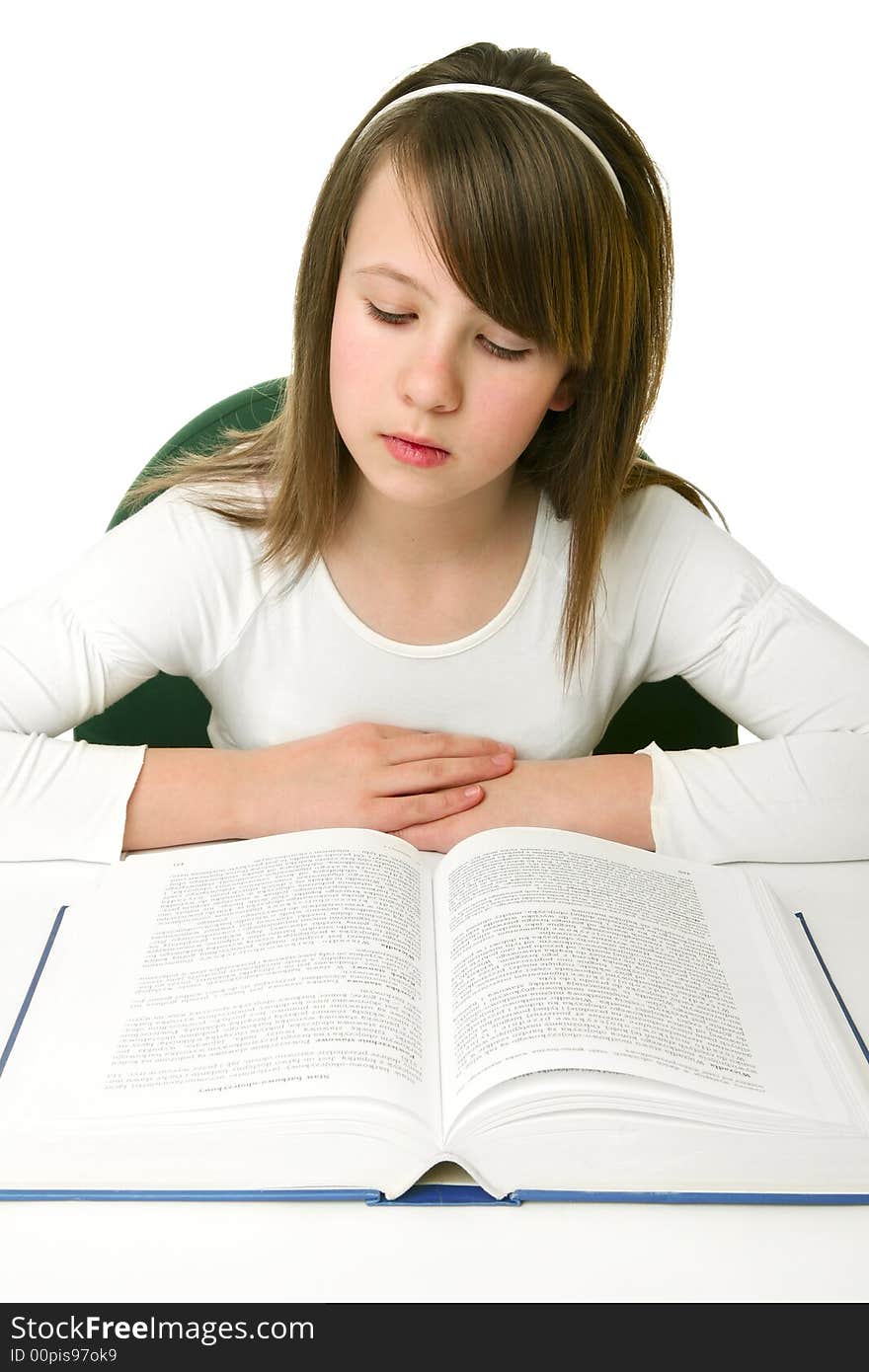 Portrait of Happy young schoolgirl reading book