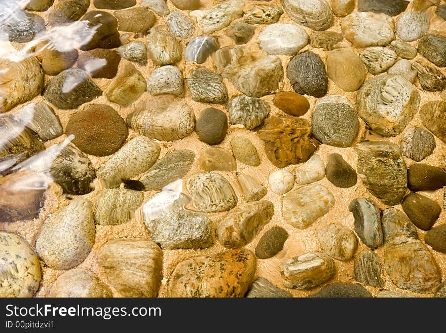 Colorful River Rocks under the flow of clear water. Colorful River Rocks under the flow of clear water