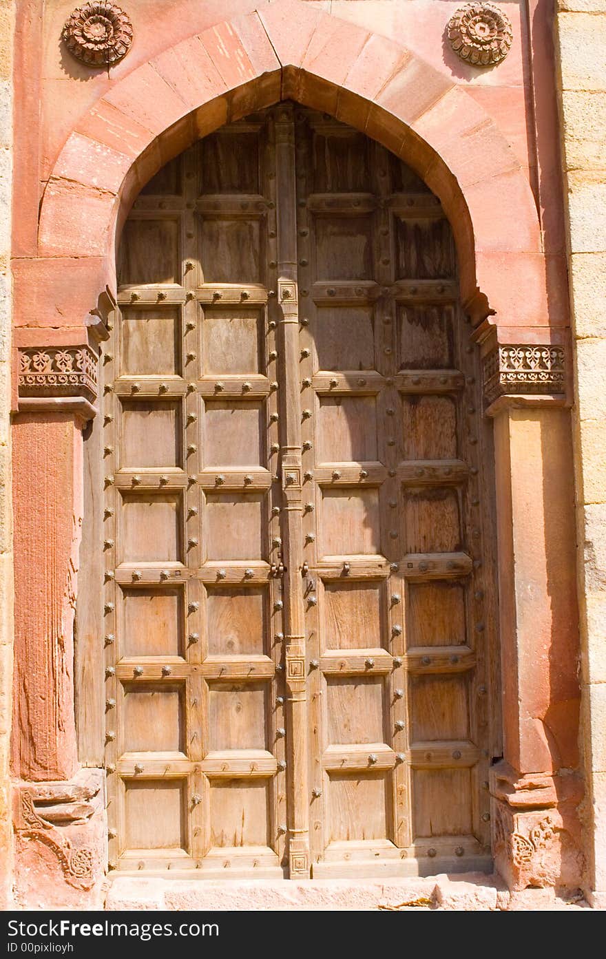 This is a photograph of old wooden door in old fort(purana qila) delhi, india.