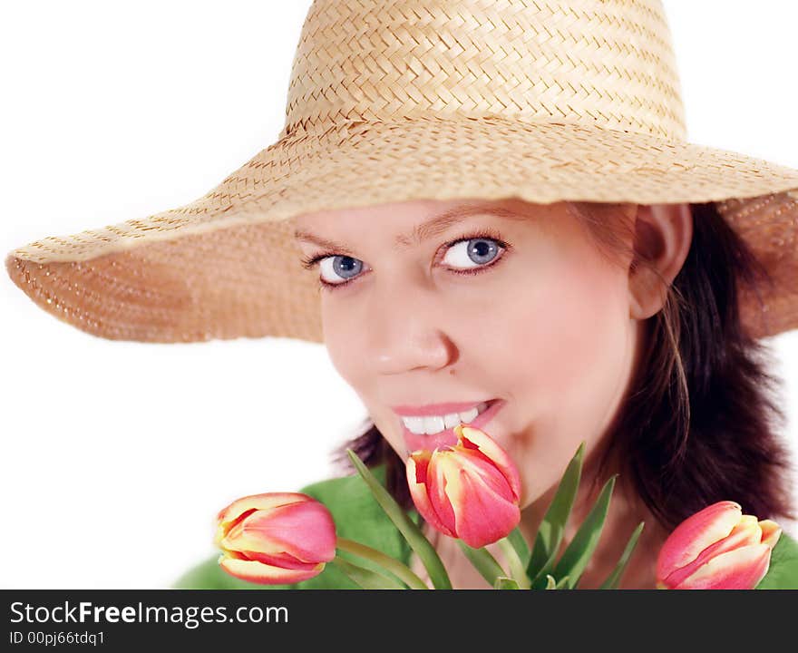 Young woman with strawhat and a bunch of tulips,isolated on white. Young woman with strawhat and a bunch of tulips,isolated on white