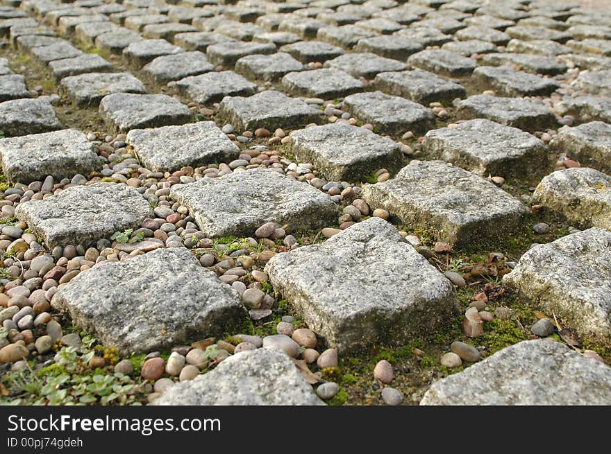 Stone block paving perspective with pebbles