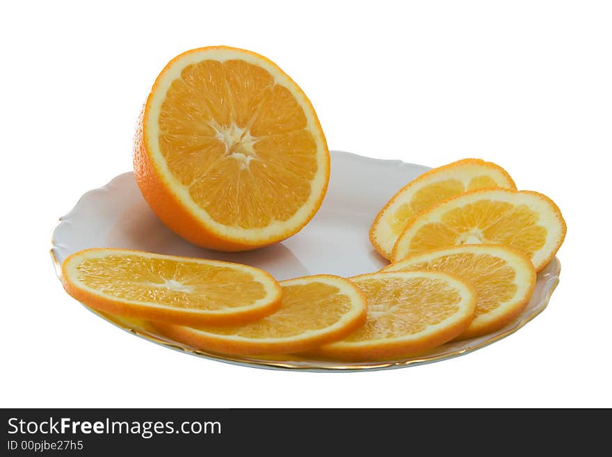 Orange juicy slices on a plate isolated on white. Orange juicy slices on a plate isolated on white