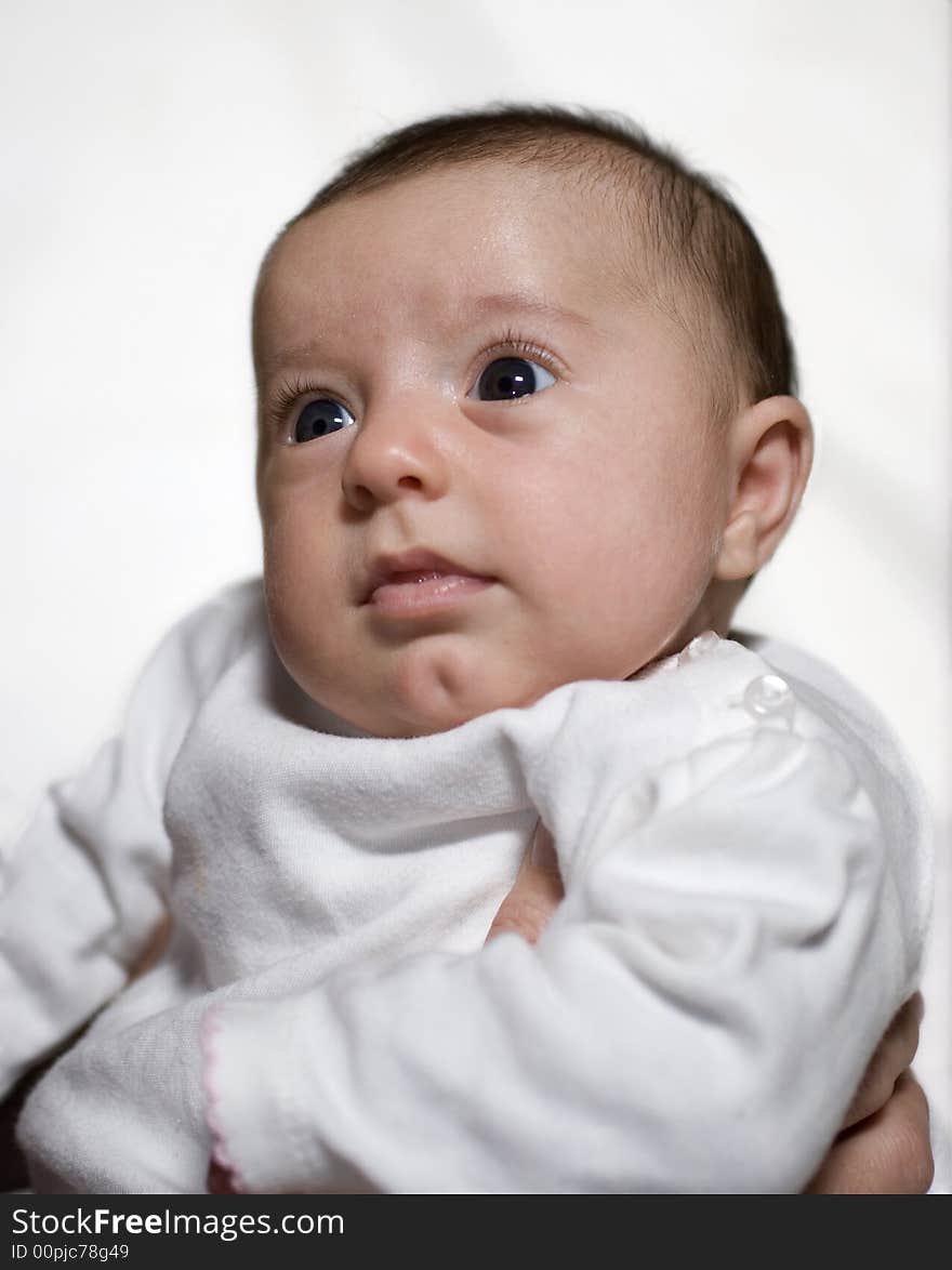 3 month old baby against a white background