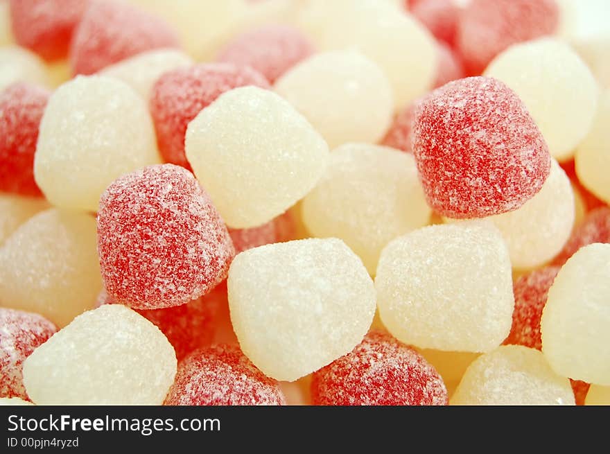 Brightly colored valentine candies on a white background. Brightly colored valentine candies on a white background