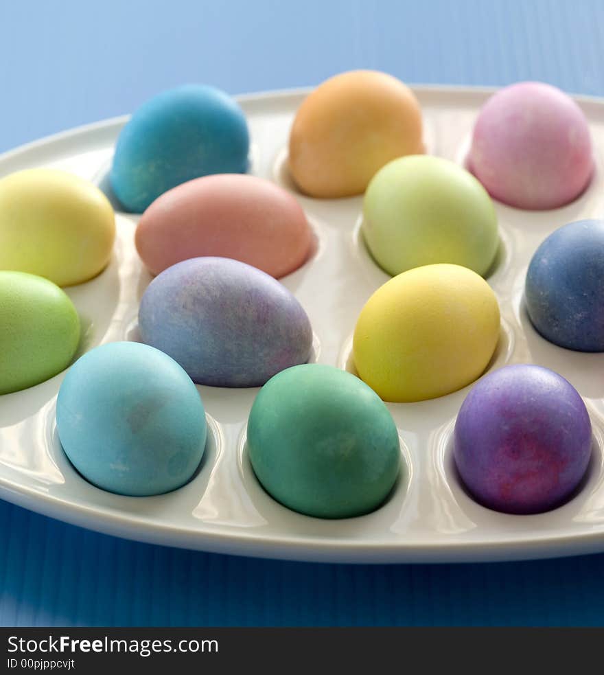 Studio shot of colored easter eggs set on tray. Studio shot of colored easter eggs set on tray