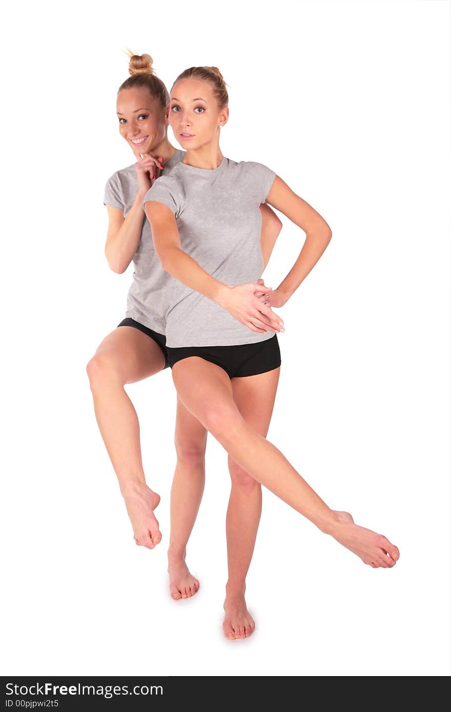 Twin sport girls posing balancing