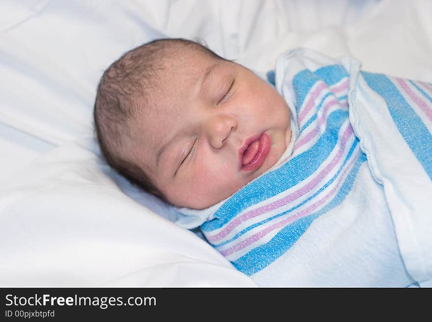 Newborn Resting with Funny Expression