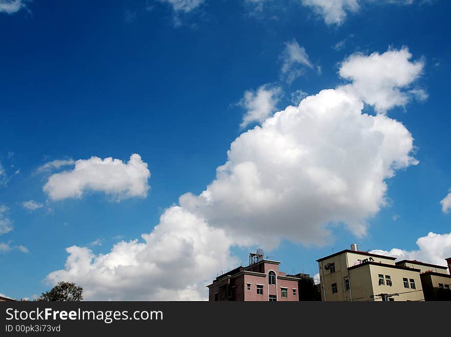 Blue sky with white clouds, a large white clouds floating in the sky.