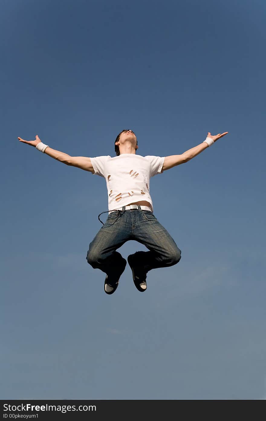 Flying man isolated on blue sky