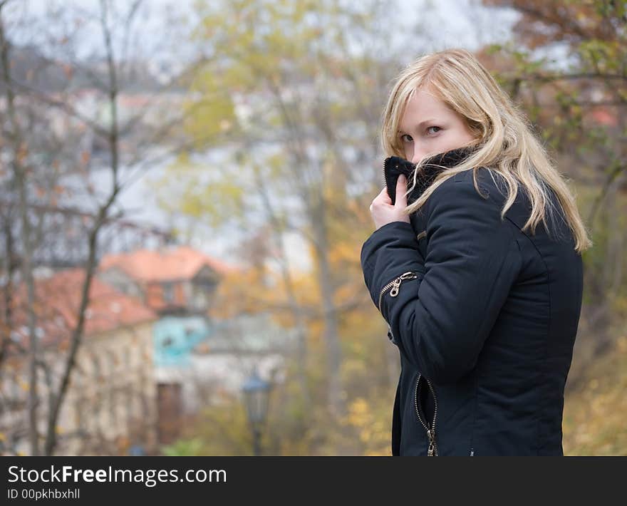 Top secret. Girl posing on trees background