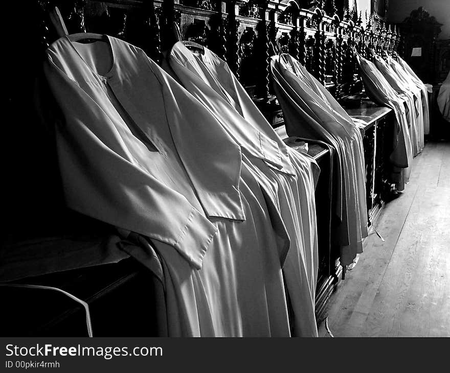 Hanging cassock in the vestry in an old church. Hanging cassock in the vestry in an old church