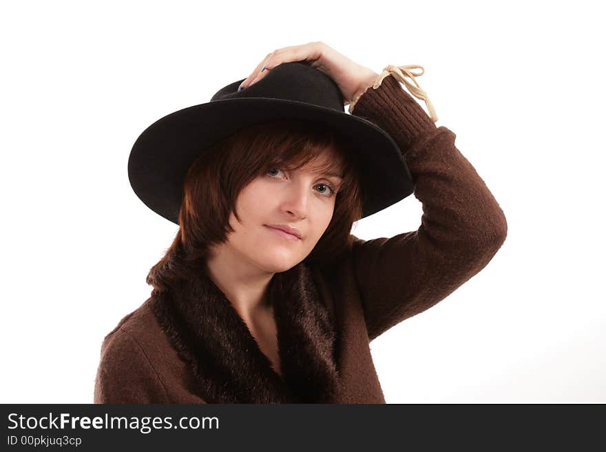 Portrait of the beautiful girl in a hat