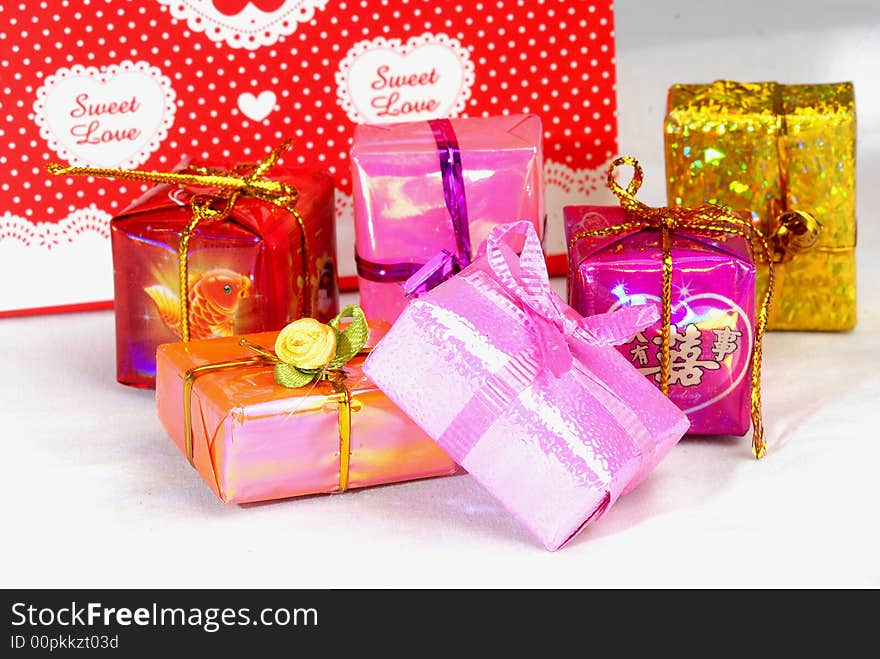 Pink color gift present box with ribbon