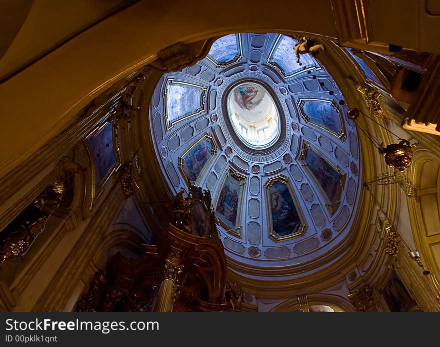 Ornate decorations on the arched ceiling of an old church. Ornate decorations on the arched ceiling of an old church