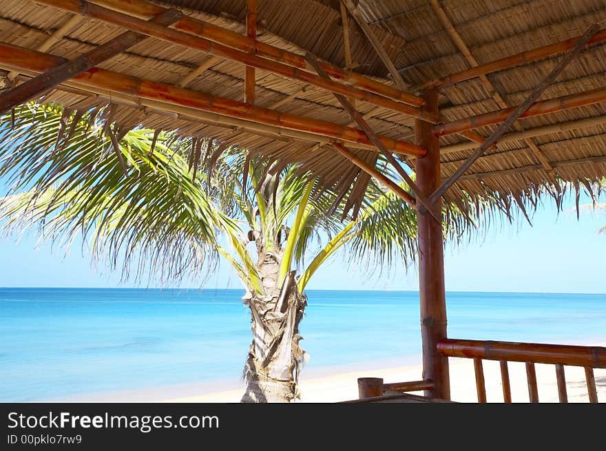 View of nice exotic bamboo hut on tropical beach. View of nice exotic bamboo hut on tropical beach