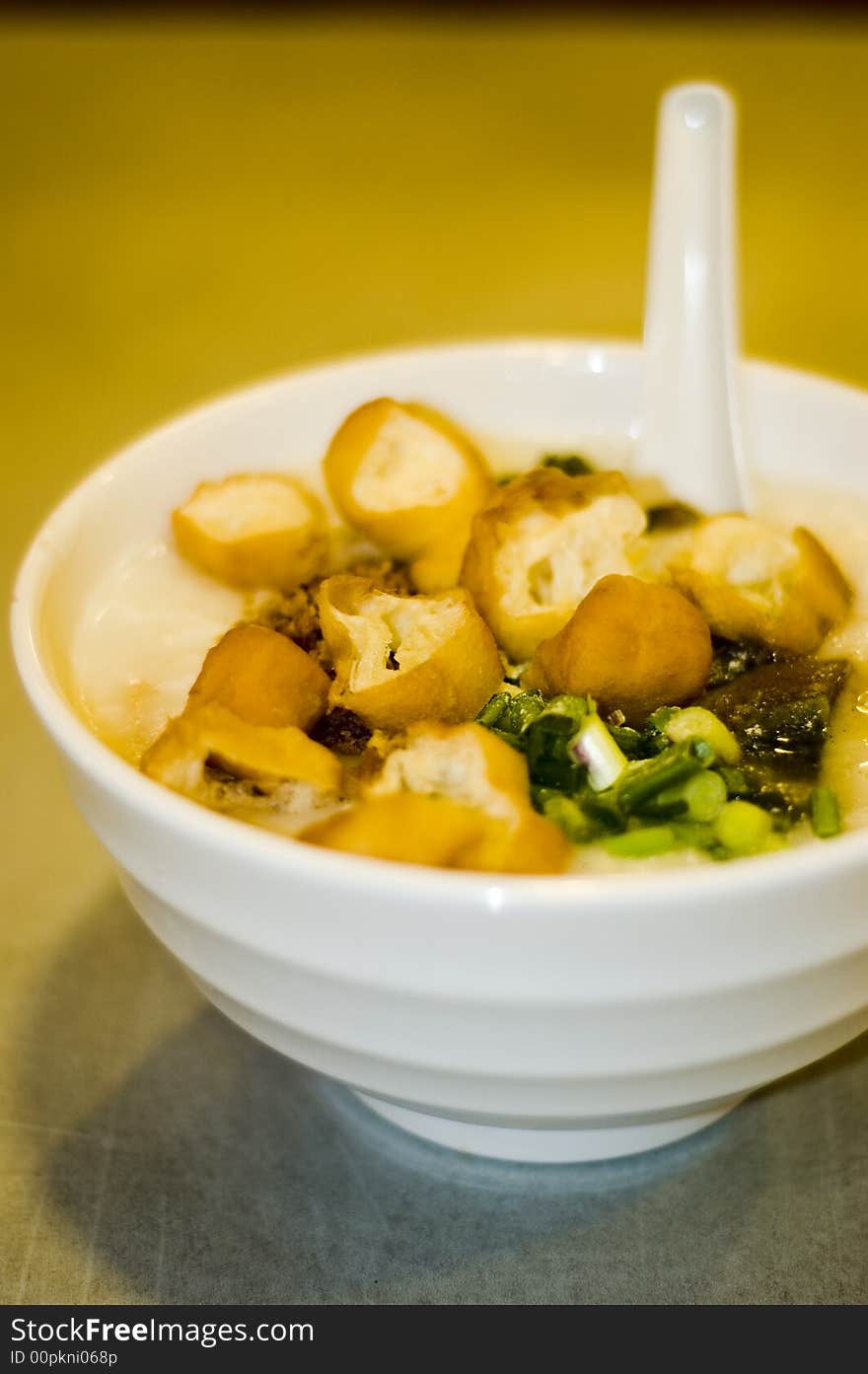 Congee With Fried Stick Dough and Spring Onions