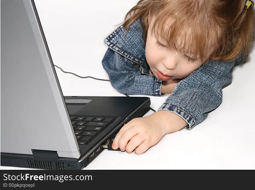 Girl Using Laptop.  Connecting USB Device.