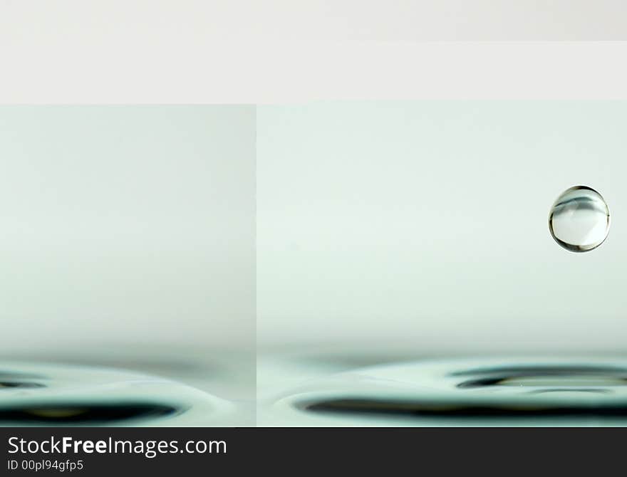 An isolated water drop over white. An isolated water drop over white